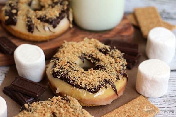 S'mores Donuts ~ Homemade Donuts Loaded with Marshmallow Frosting then Drizzled with Chocolate and Topped with Crushed Graham Crackers!