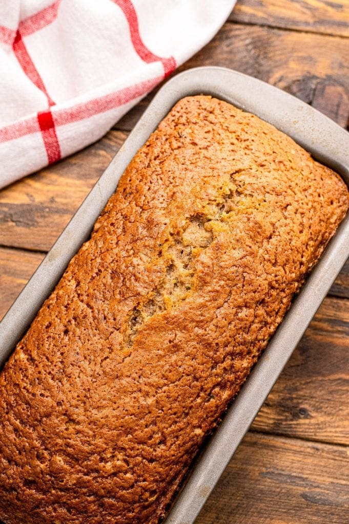 Overhead image of a baked loaf of Banana Zucchini Bread.