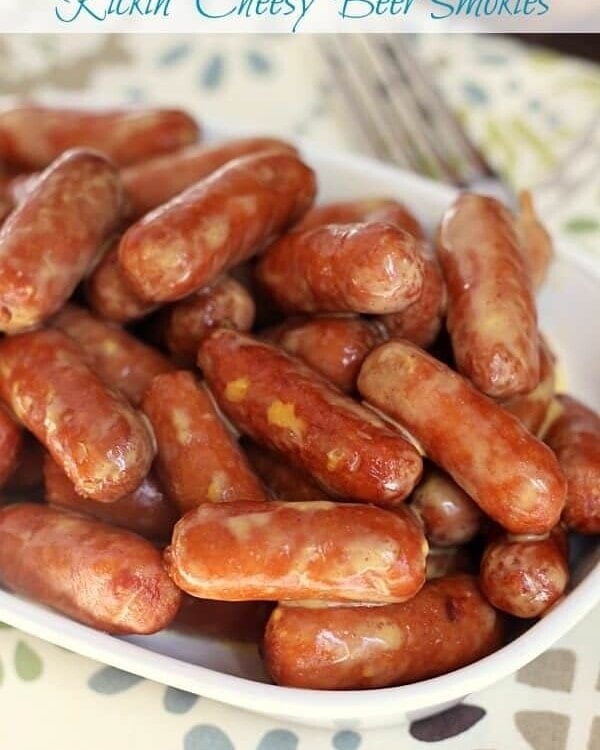 Crock pot kickin' cheesy beer smokies in a white bowl