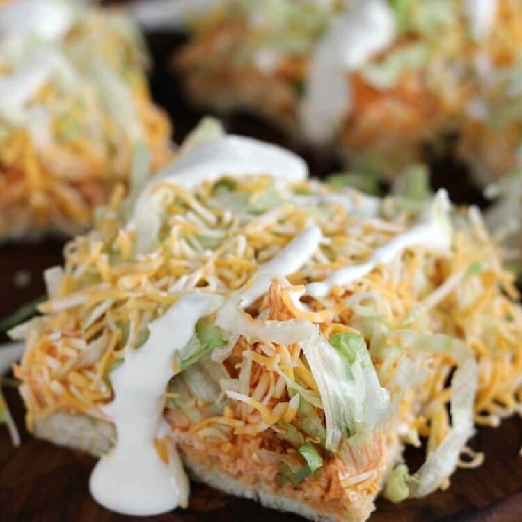 Buffalo Ranch Chicken Pizza ~ Flaky Crescent Rolls Piled with Cream Cheese, Buffalo Chicken, Lettuce, Cheese and Blue Cheese Dressing!