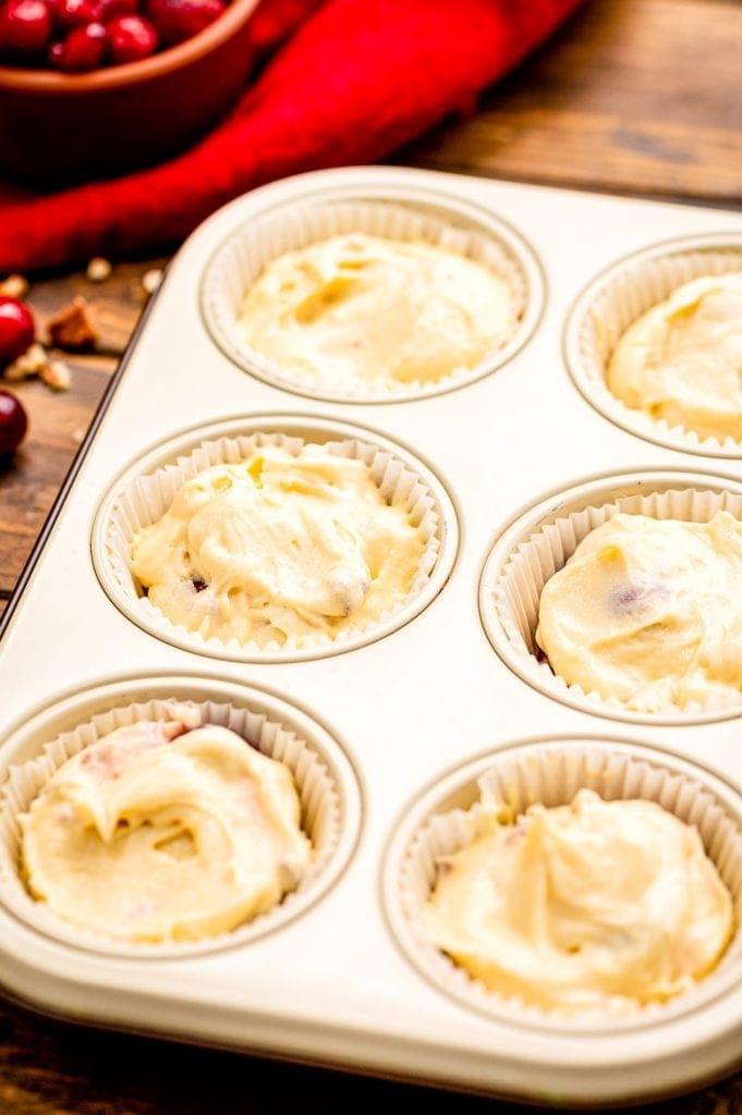 Cream Cheese Cranberry Muffins batter in muffin cups before baking