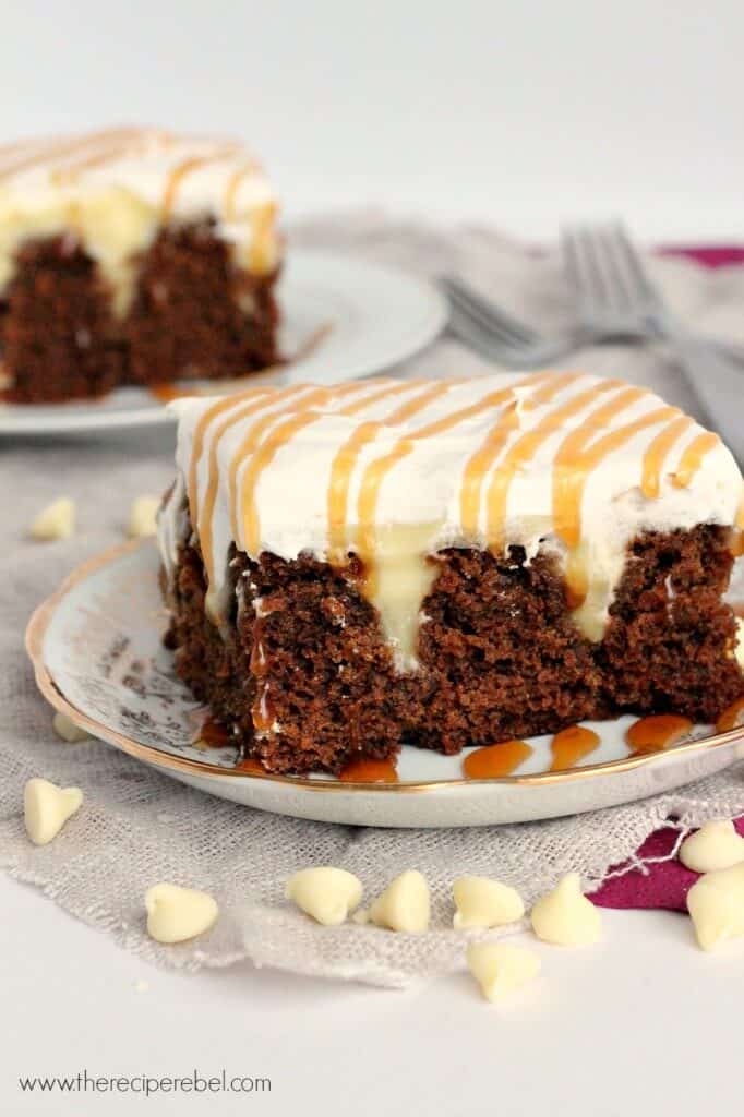 White Chocolate Gingerbread Poke Cake: moist spice cake filled with creamy white chocolate pudding and topped with whipped cream. The perfect dessert for the holidays!