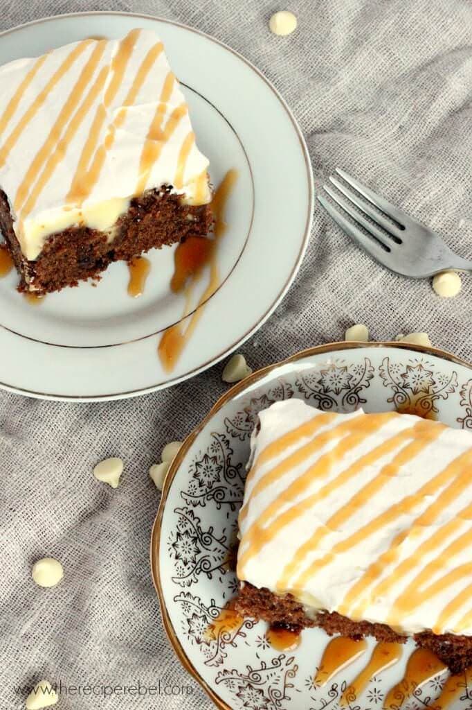 White Chocolate Gingerbread Poke Cake: moist spice cake filled with creamy white chocolate pudding and topped with whipped cream. The perfect dessert for the holidays!