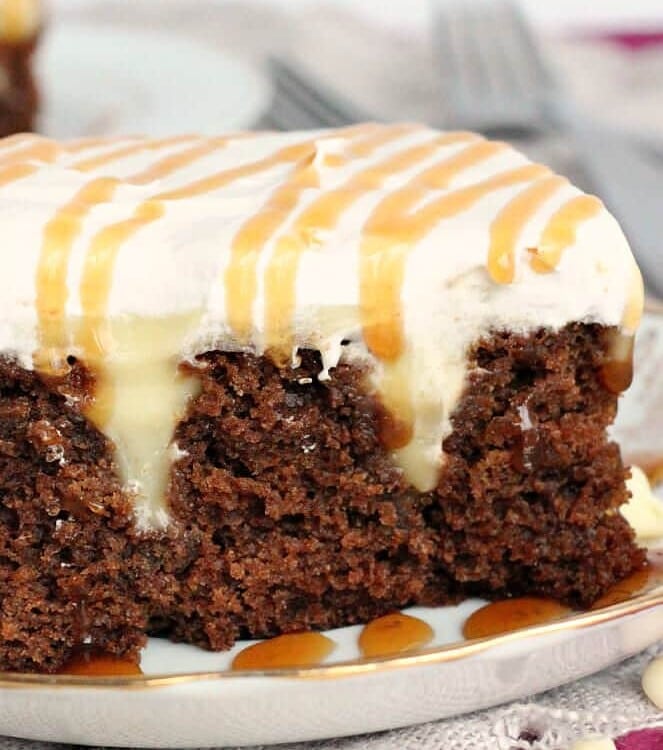 White Chocolate Gingerbread Poke Cake ~ Delicious, Moist Gingerbread Cake Layered with White Chocolate Pudding and Cool Whip!