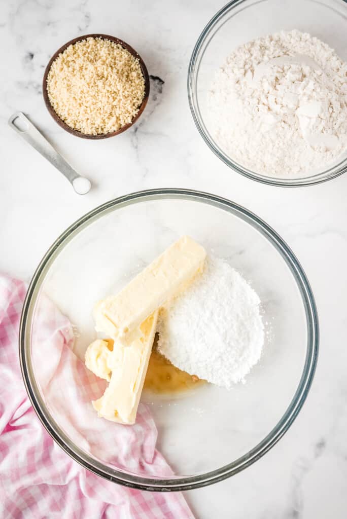 Mixing bowl with butter, vanilla, and powdered sugar