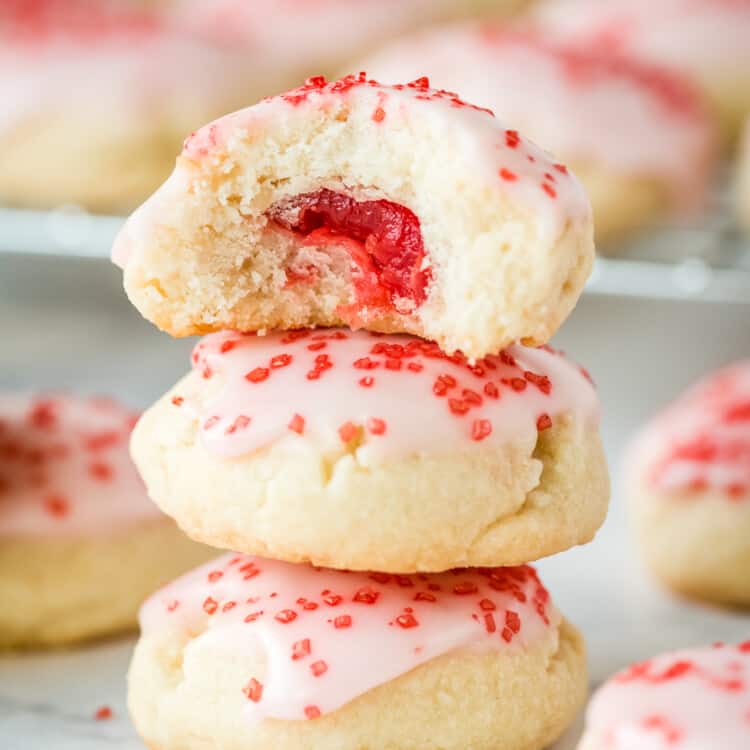 Almond Sugar Cookies stacked with top one cut open