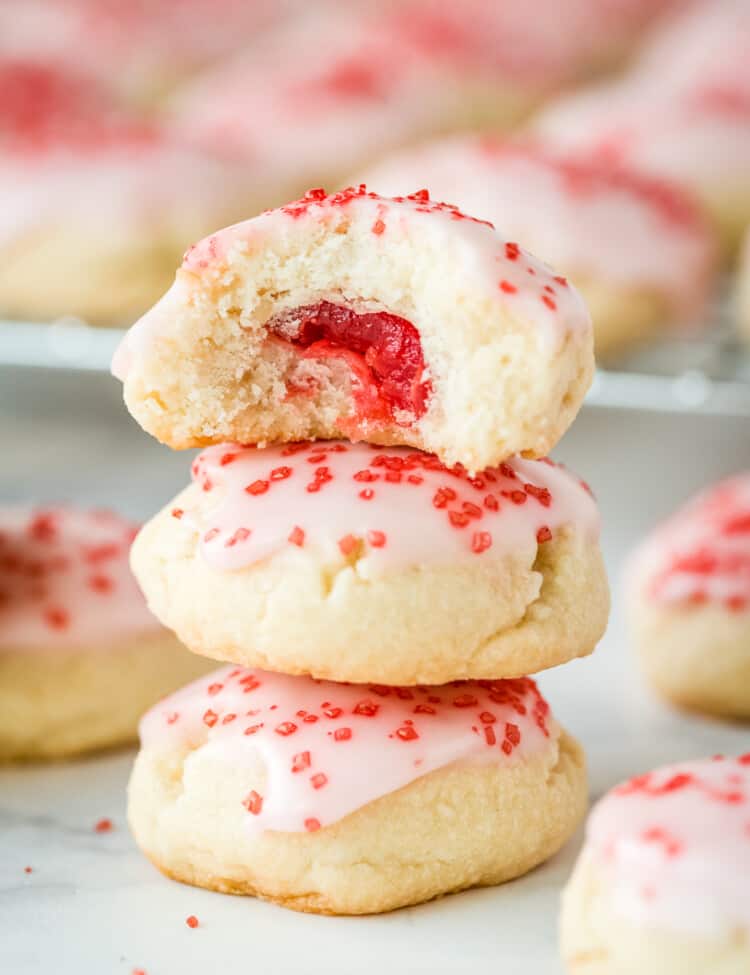 Almond Sugar Cookies stacked with top one cut open