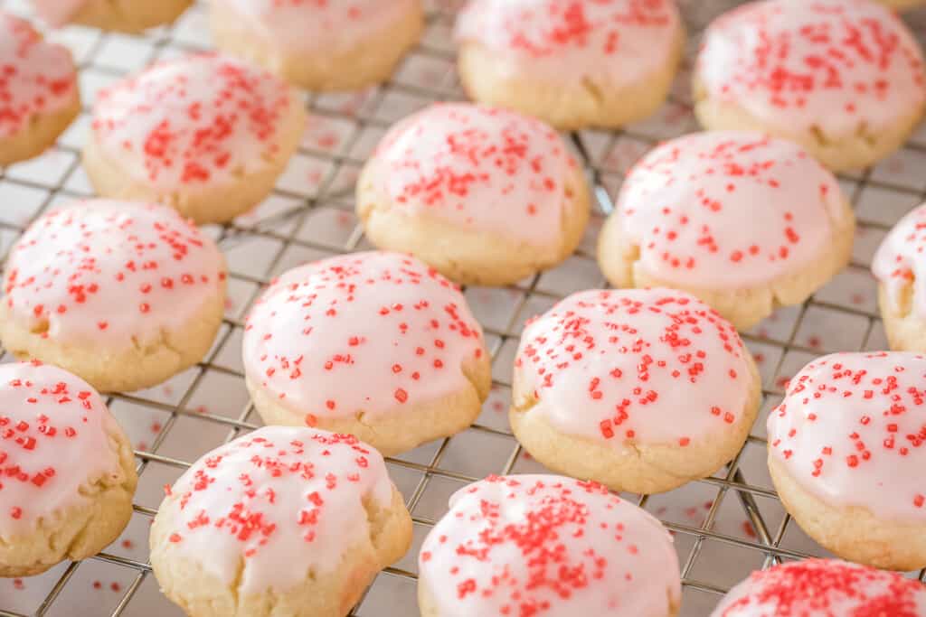 Wire rack with frosted Almond Sugar Cookies