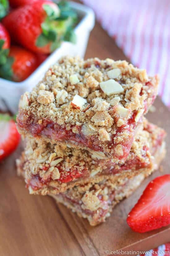 Whole Grain Strawberry Breakfast Bars ~ Delicious & Easy whole grain oat bars filled with strawberries and topped with an almond crumble! Perfect for Breakfast or a Sweet Treat!