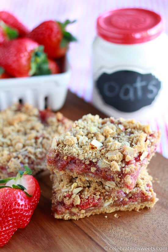 Whole grain oat bars filled with strawberries and topped with an almond crumble