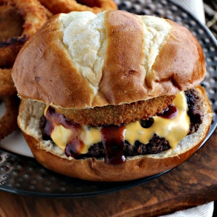 Rodeo Burgers ~ Freshly Grilled Hamburger Topped with Cheese, BBQ Sauce and an Onion Ring on a Pretzel Bun!