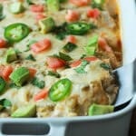 Chicken Enchiladas topped with a Creamy Green Chili Sauce made with Greek Yogurt and spicy green chilis! An easy weeknight meal that will beat going out to eat any day of the week!