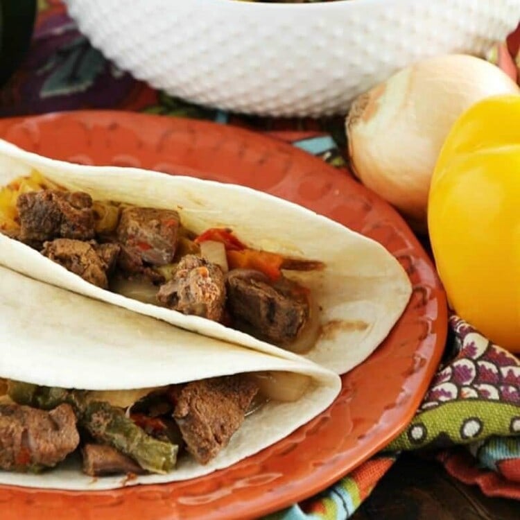 Crock Pot Steak Fajitas ~ Loaded with Steak, Red Peppers, Green Peppers, Yellow, Peppers, Onions and Spices! Piled High on a Tortilla Shell! The Perfect Quick, Easy Weeknight Recipe!