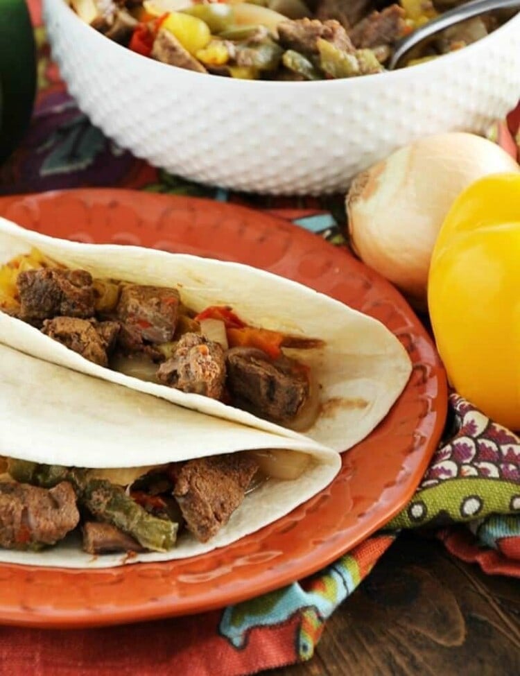 Crock Pot Steak Fajitas ~ Loaded with Steak, Red Peppers, Green Peppers, Yellow, Peppers, Onions and Spices! Piled High on a Tortilla Shell! The Perfect Quick, Easy Weeknight Recipe!