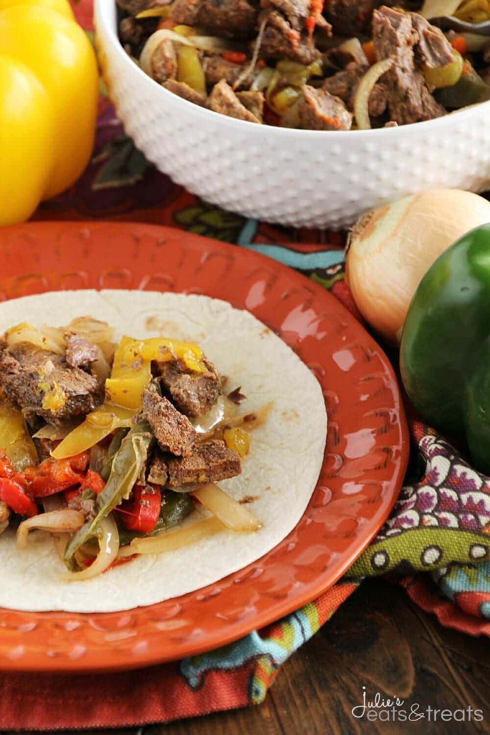 Crock Pot Steak Fajitas ~ Loaded with Steak, Red Peppers, Green Peppers, Yellow, Peppers, Onions and Spices! Piled High on a Tortilla Shell! The Perfect Quick, Easy Weeknight Recipe!