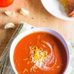 This Slow Cooker Tomato Basil Soup is creamy, rich with flavor and perfect for spring! Throw it in the Crock Pot and it will be waiting for you when you are ready to eat!