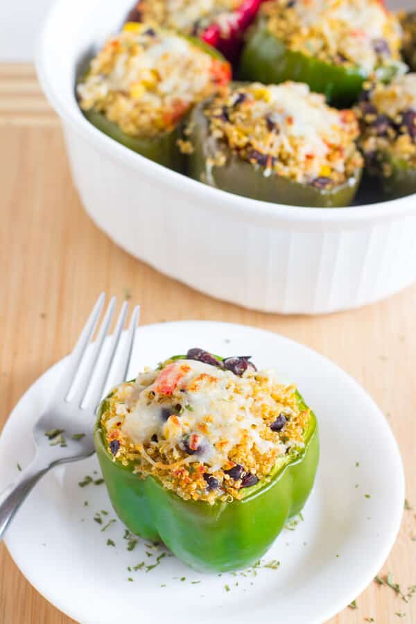 These Tex Mex Quinoa Stuffed Peppers are a healthy protein packed, delicious and easy weeknight meal for your family!