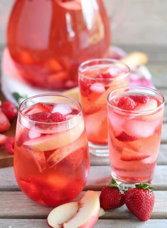 Peach Rosé Sangria - Rosé, peach juice, peach liqueur, and fresh fruit combine in this beautiful sangria.