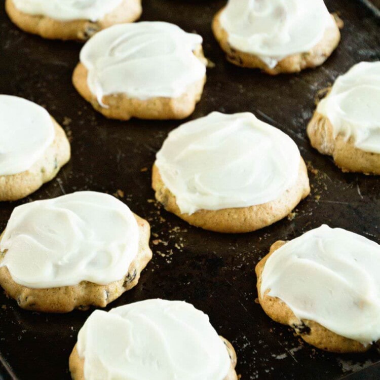 Zucchini cookies with frosting on a baking sheet
