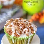 Apple crumb cupcake in a green cupcake liner sitting on a white stand