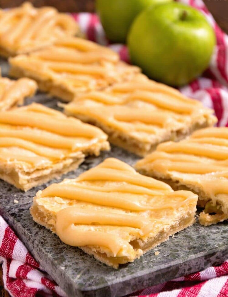 Apple Bars with Caramel Frosting ~ Soft, flaky crust stuffed with homemade apple pie filling and drizzled with caramel frosting!