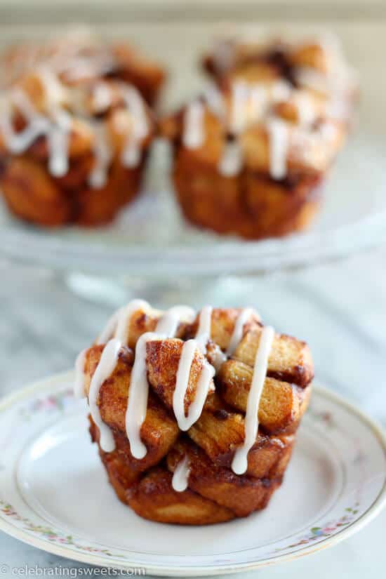 Cinnamon Roll Monkey Bread Muffins - Use cinnamon rolls for this tasty twist on monkey bread. Sweet, soft, filled with cinnamon, and topped with cream cheese icing.
