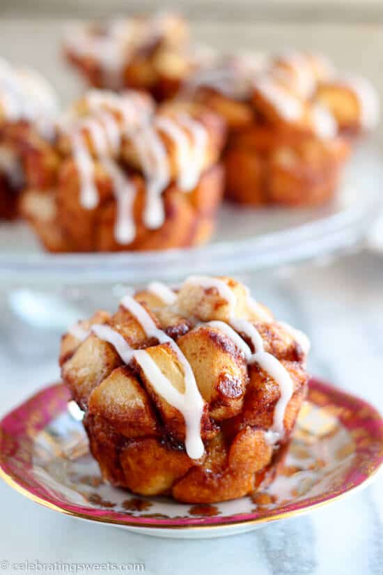 Cinnamon Roll Monkey Bread Muffins Recipe ~ Use cinnamon rolls for this easy and tasty twist on monkey bread. Sweet, soft, filled with cinnamon, and topped with cream cheese icing!