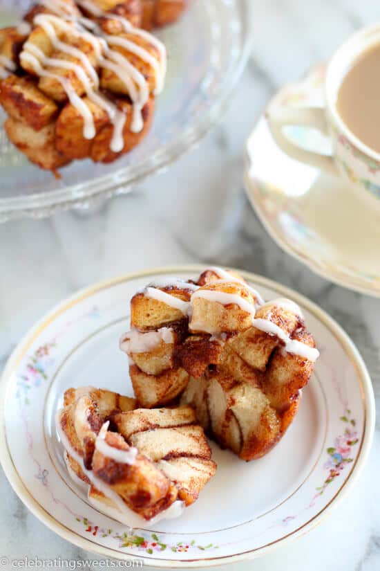 Cinnamon Roll Monkey Bread Muffins - Use cinnamon rolls for this tasty twist on monkey bread. Sweet, soft, filled with cinnamon, and topped with cream cheese icing.