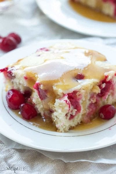 Cranberry Cake with Caramel Sauce Recipe ~ Moist vanilla cake filled with cranberries and covered in a warm caramel sauce! An elegant holiday dessert that is super easy!