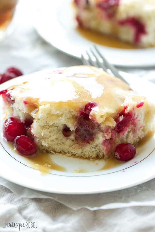 Cranberry Cake with Caramel Sauce Recipe ~ Moist vanilla cake filled with cranberries and covered in a warm caramel sauce! An elegant holiday dessert that is super easy!