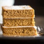 Stack of three skinny gluten free pumpkin cheesecake bars