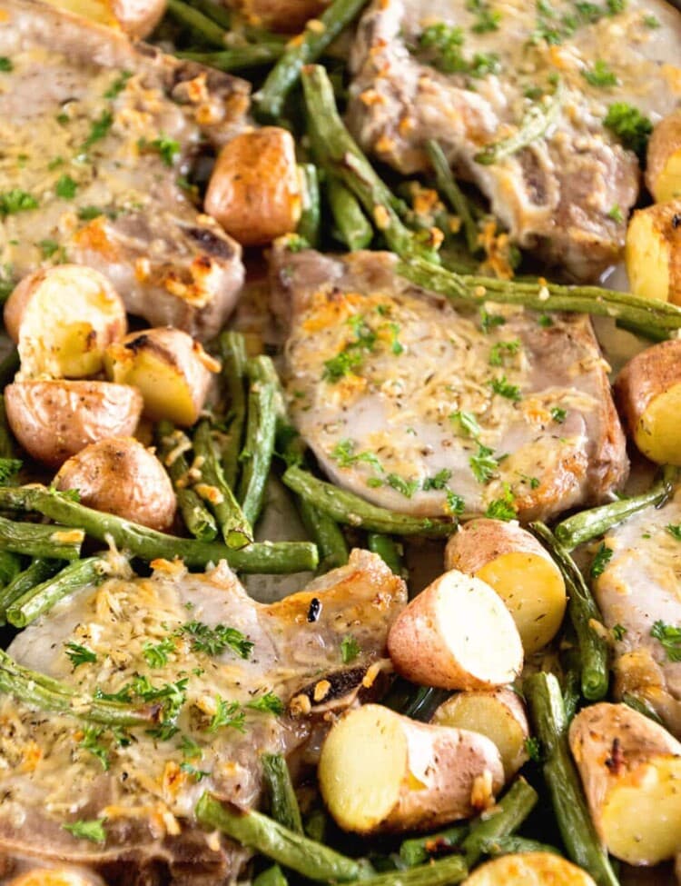 One Pan Parmesan Pork Chops and Veggies Recipe ~ Juicy Pork Chops Baked in the Oven with Potatoes and Veggies Seasoned with Garlic, Thyme and Parmesan! Quick, Healthy, Light Dinner ready in 30 Minutes!