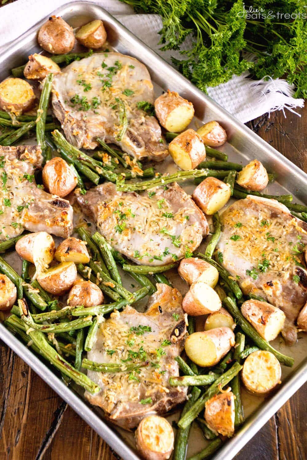 One Pan Parmesan Pork Chops and Veggies Recipe ~ Juicy Pork Chops Baked in the Oven with Potatoes and Veggies Seasoned with Garlic, Thyme and Parmesan! Dinner ready in 30 Minutes!