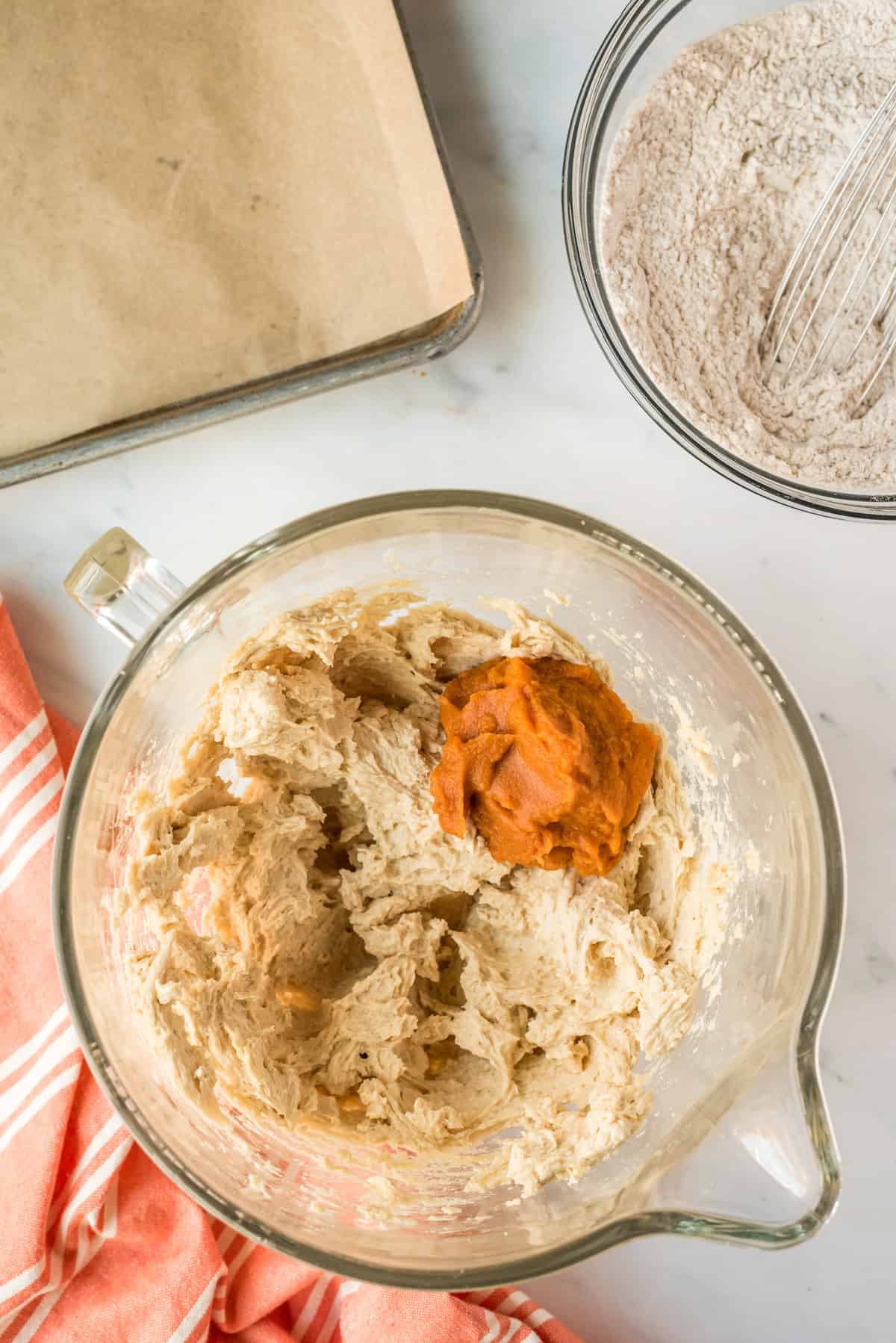 Cookie batter with pumpkin in a bowl