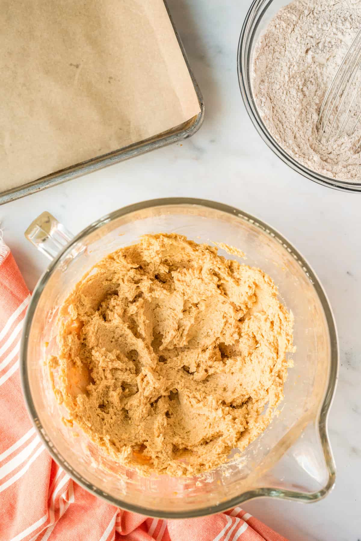 Pumpkin cookie batter in bowl