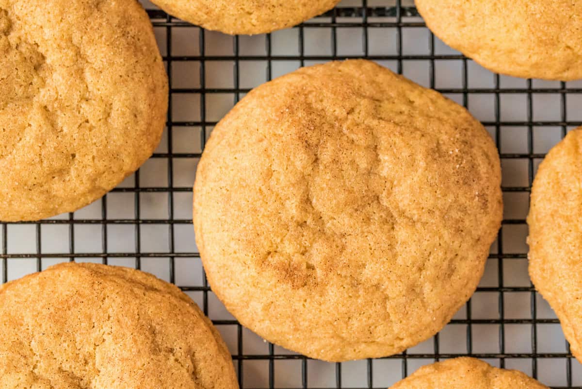 Cooling rack with pumpkin snickerdoodle cookies on it