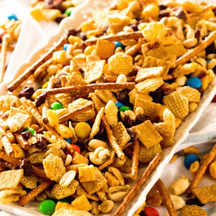 Snack Mix ~ This Snack Mix is like CRACK! So Addictive and Delicious! Full of Cereal, Pretzels, Peanuts, M&Ms and Raisins! Perfect for Christmas and Holiday Parties!