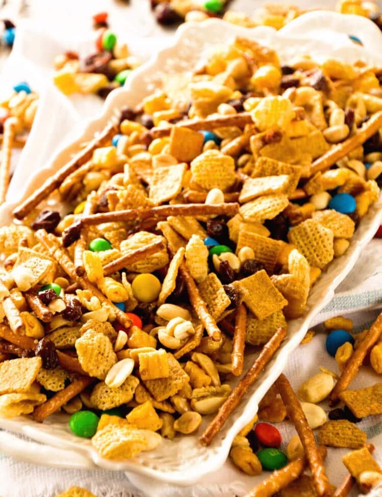 Snack Mix ~ This Snack Mix is like CRACK! So Addictive and Delicious! Full of Cereal, Pretzels, Peanuts, M&Ms and Raisins! Perfect for Christmas and Holiday Parties!