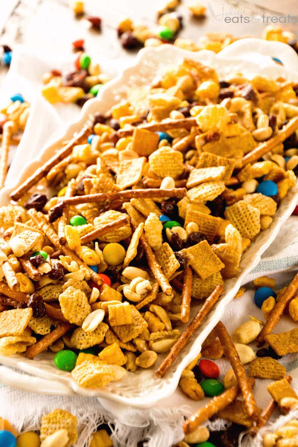 Snack Mix ~ This Snack Mix is like CRACK! So Addictive and Delicious! Full of Cereal, Pretzels, Peanuts, M&Ms and Raisins! Perfect for Christmas and Holiday Parties!