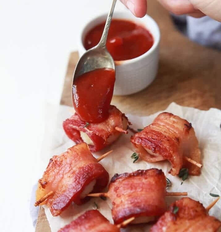 Bacon Wrapped Water Chestnuts Recipe served with a Sweet Dipping Sauce. This appetizer is sweet, salty, out of control delicious and so easy to make! Perfect for the holidays!