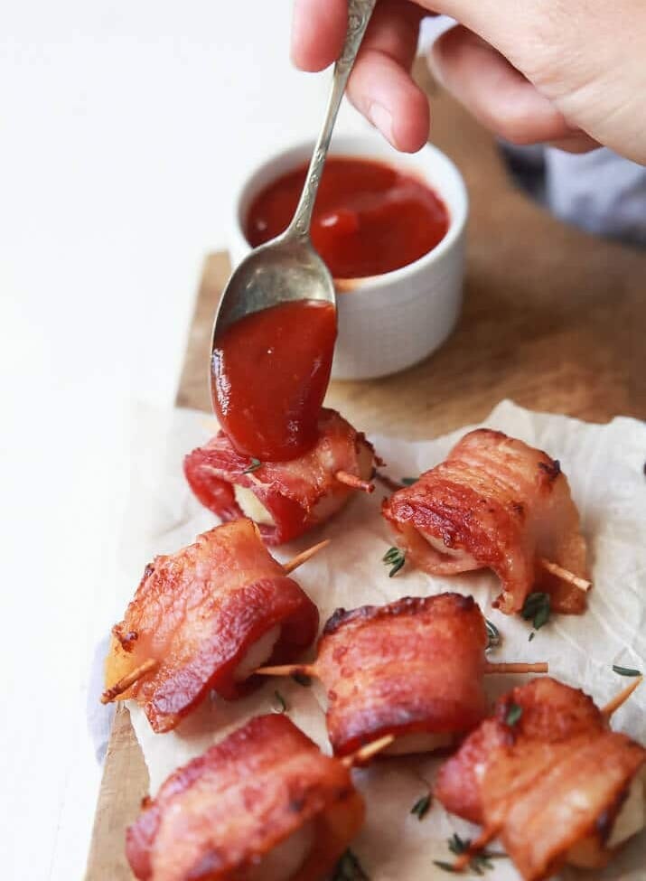 Bacon Wrapped Water Chestnuts Recipe served with a Sweet Dipping Sauce. This appetizer is sweet, salty, out of control delicious and so easy to make! Perfect for the holidays!