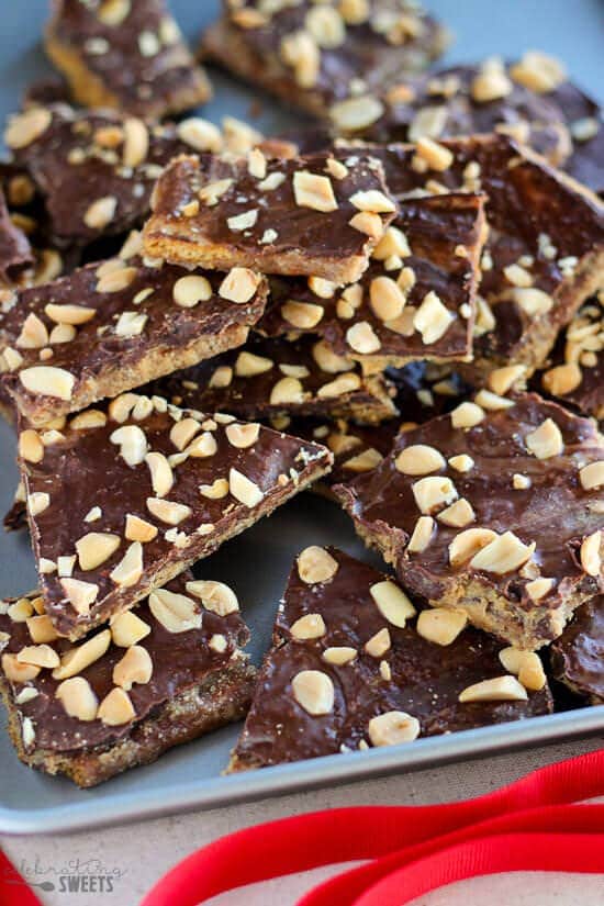 Peanut Butter Graham Cracker Toffee - Peanut butter and chocolate combine in this easy graham cracker toffee recipe. Sweet and salty with crunchy buttery layers.