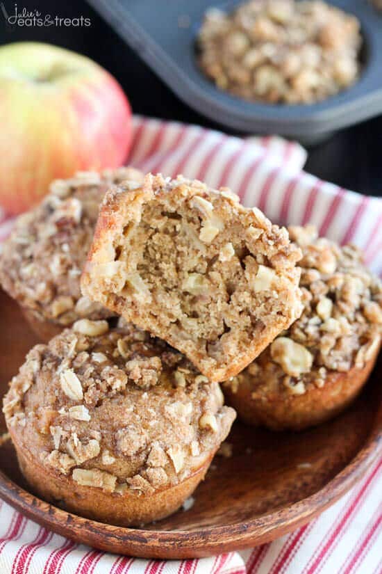 Stack of Apple Oatmeal Muffins on brown plate with one split in half