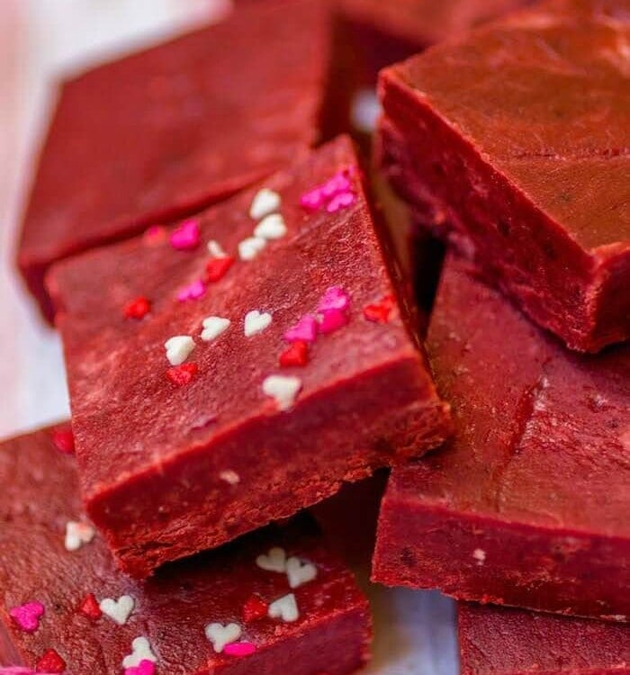 Red Velvet Fudge - This super easy fudge comes together in minutes and just melts in your mouth! It's the perfect addition to your Valentine's Day dessert spread.