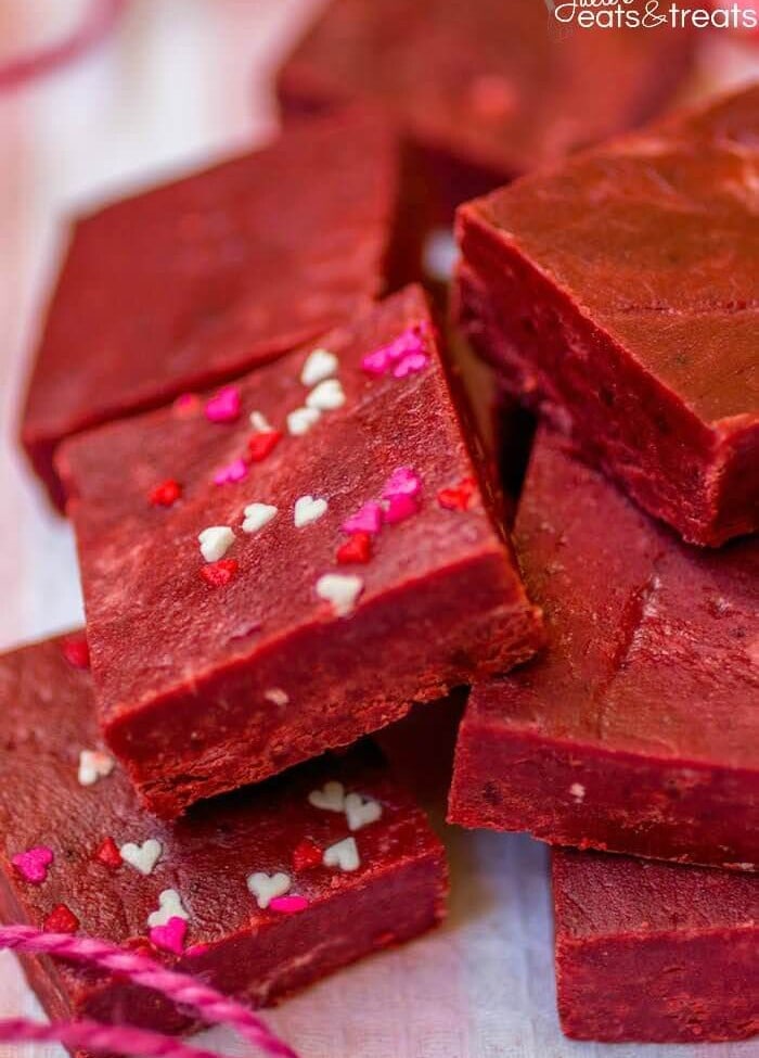 Red Velvet Fudge - This super easy fudge comes together in minutes and just melts in your mouth! It's the perfect addition to your Valentine's Day dessert spread.