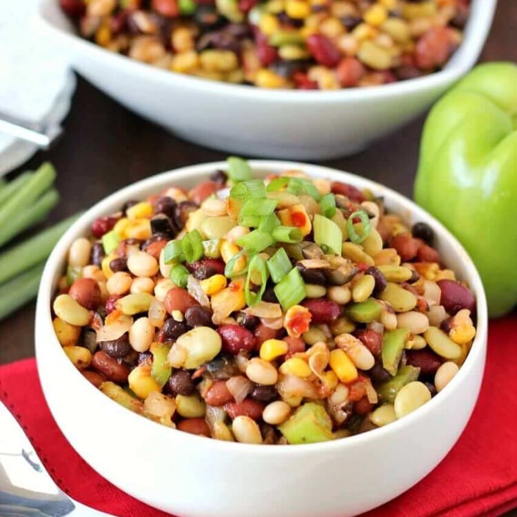 Colorful Bean Salad - A delicious array of flavors and beans brings this side dish to a whole new level. Plus it's easy to throw together on a busy night!