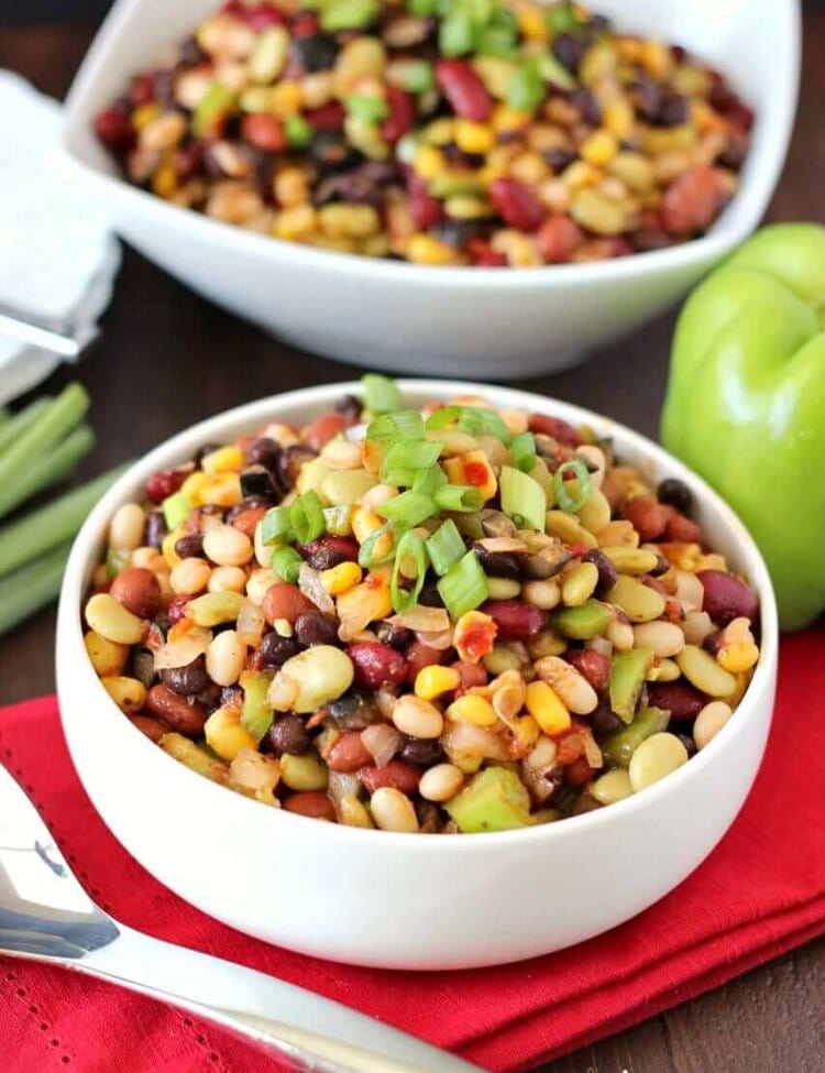 Colorful Bean Salad - A delicious array of flavors and beans brings this side dish to a whole new level. Plus it's easy to throw together on a busy night!