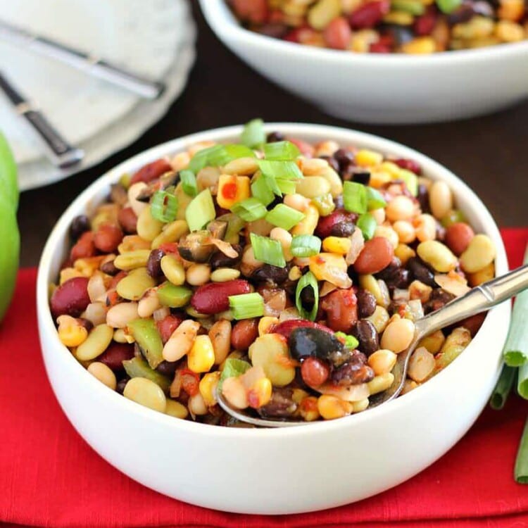 Colorful Bean Salad - A delicious array of flavors and beans brings this side dish to a whole new level. Plus it's easy to throw together on a busy night!