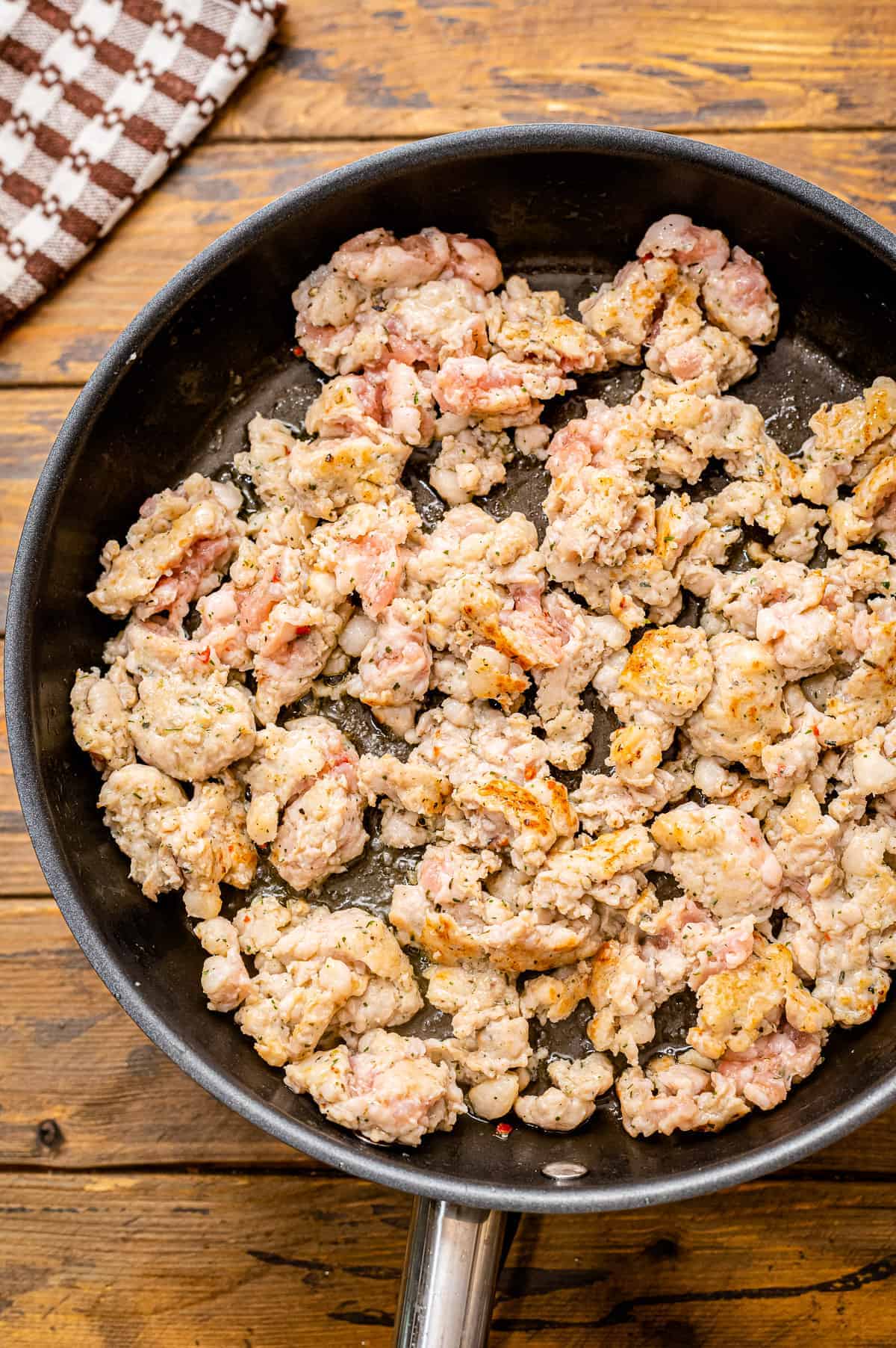 Cooking ground sausage in black skillet