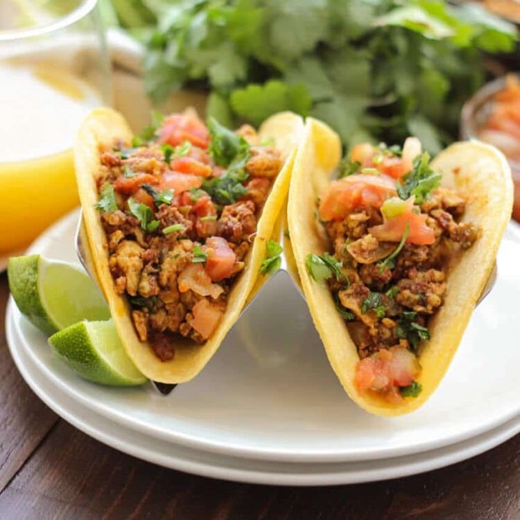 Chorizo Breakfast Tacos ~ Soft scrambled eggs mixed with chorizo and vegetables, then stuffed into a corn tortilla with beans. Topped with some salsa, pico de gallo and cheese. This is a breakfast dish you won't want to miss!